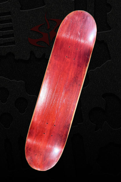We see the top of a skate deck with its warm red griptape that looks like aged wood.