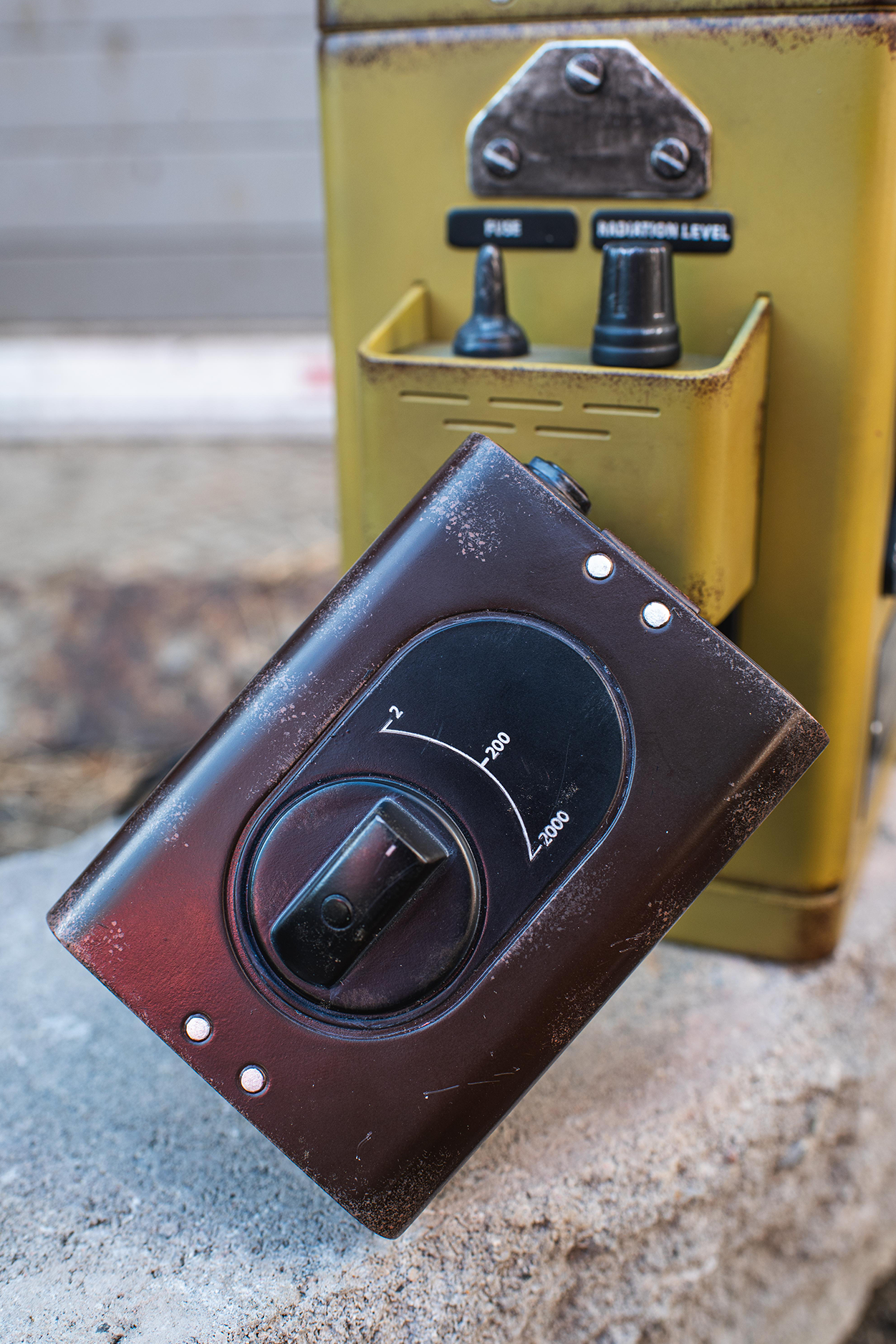 Vintage-style control panel with knobs on a textured surface