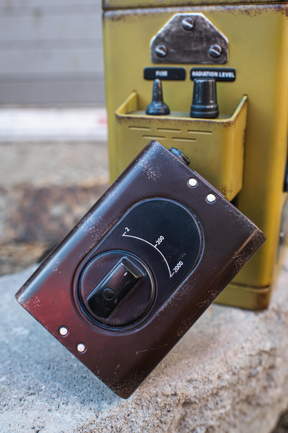 Vintage-style control panel with knobs on a textured surface