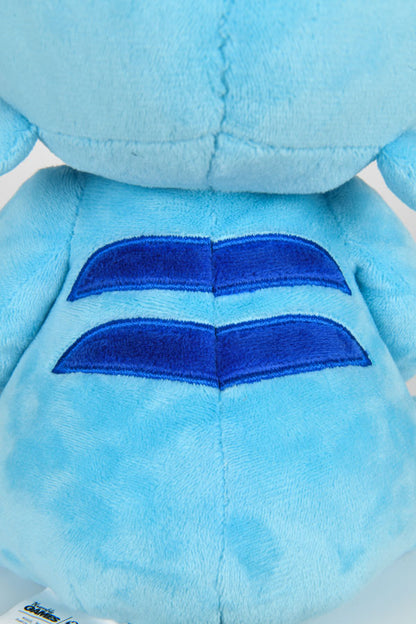 Image shows the back of the Temtem Platypet Plush zoomed in. The Platypet's back have two blue stripes run along the back length wise evenly spaced above the tail with the higher stripe being shorter than the lower.