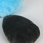 Image shows Temtem Platypet Plush's platypus tail zoomed in. The Platypet's platypus tail is black in color.