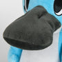 Image shows Temtem Platypet Plush's face zoomed in. Its eyes have large, vertical, and oval with black iris and pupil with two small, black, oval spots that sit on the outer side if the eyes. 